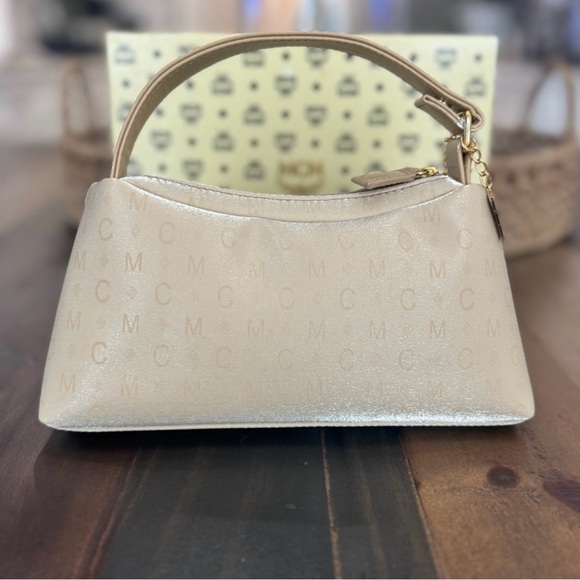 MCM Mini Top Handle Bag
Champagne Monogram Leather - Picture 3 of 15